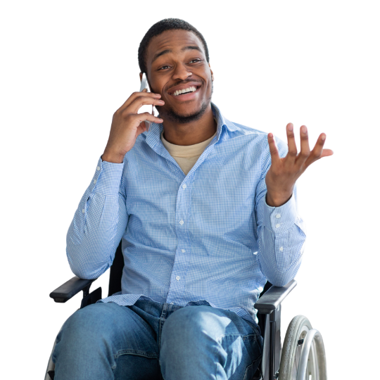 Wheelchair user smiles as they speak to our DIAL team over the phone.