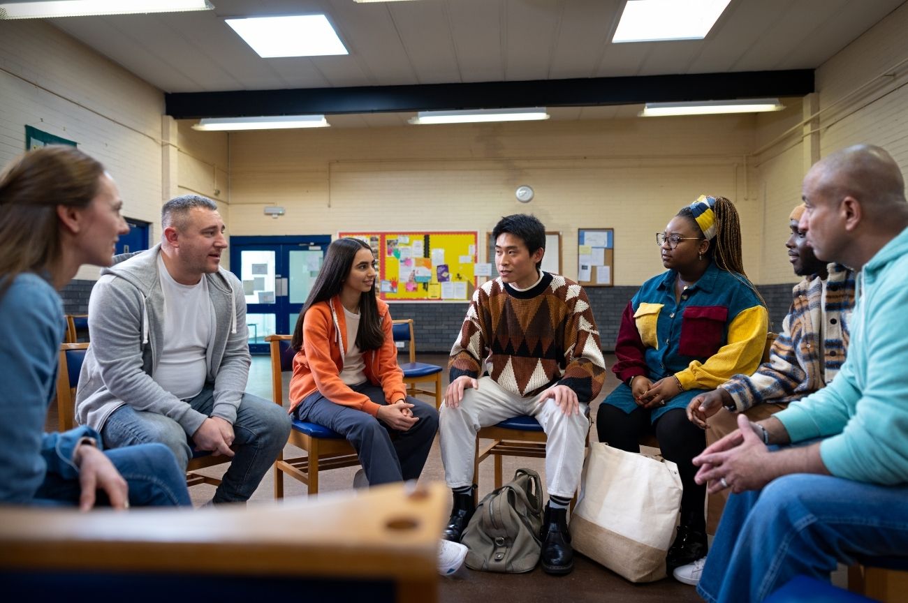 Community members come together for a DIAL community talk.