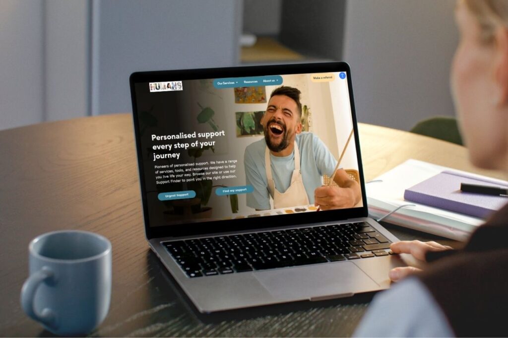 A laptop with our website open.