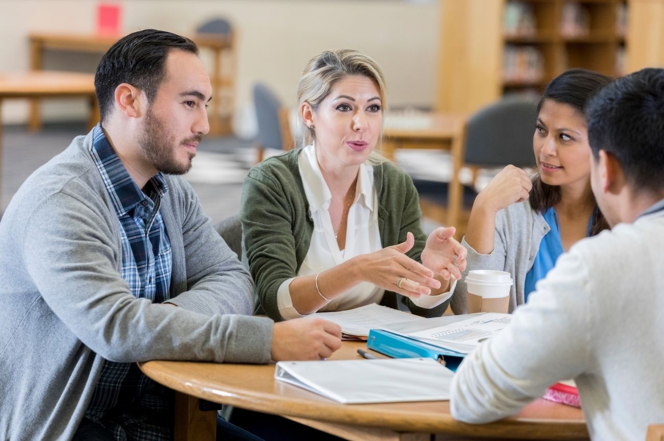 A group of people discussing care decisions on behalf of someone else.